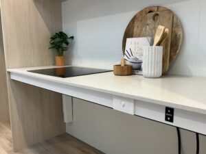 Kitchen benchtop and stove with adjustable height technology